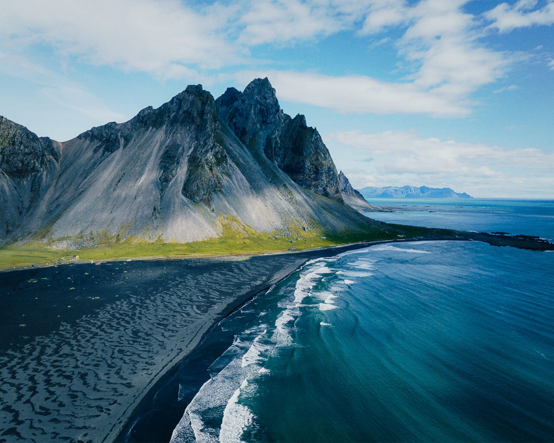 Vestrahorn mountain rising above a black beach on Iceland's south coast